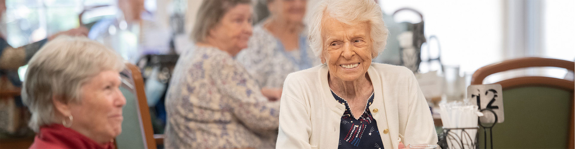 Women smiling in dining area