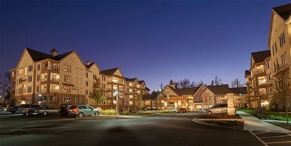 exterior shot of apartment buildings at night