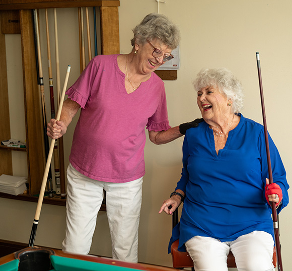 rectangle_image_ph_1 two women playing billiards